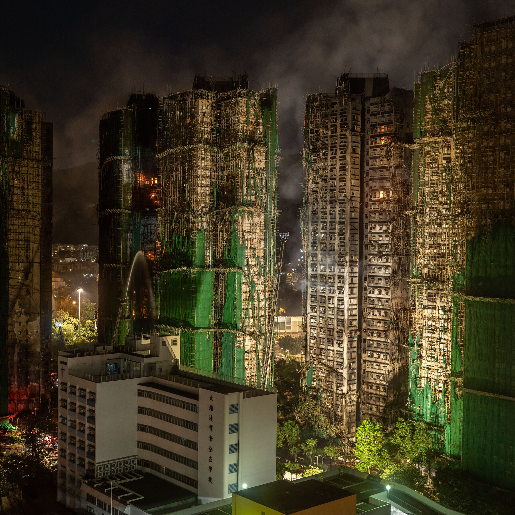 Hong Kong Contractors Used Unsafe Netting at Fire Site, Officials Say