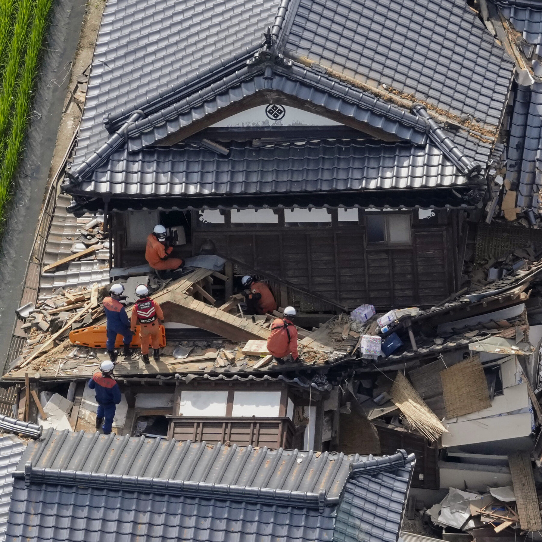 Japan Races to Reach People Trapped After Earthquake Kills at Least 13